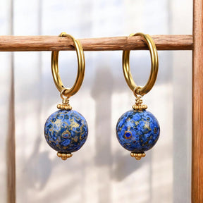 أقراط حلقية كروية مرصعة بنجوم الياقوت السماوي