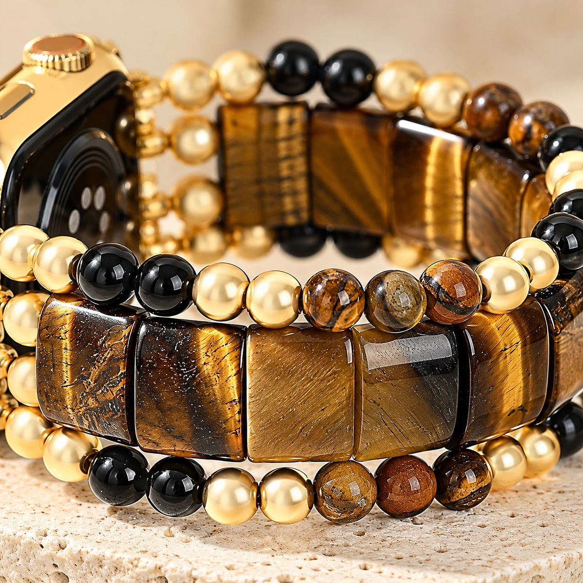 Close-up of the tiger's eye stones, onyx and gold-tone beads